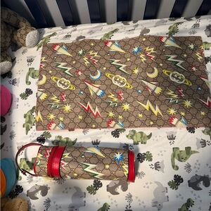 Gucci baby bottle holder and changing pad